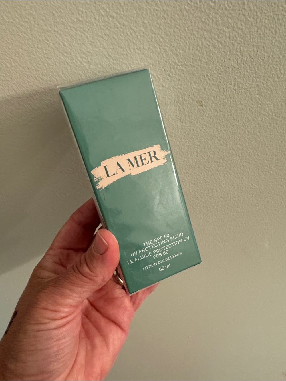 La Mer UV Protecting Fluid in Seafoam Green Box